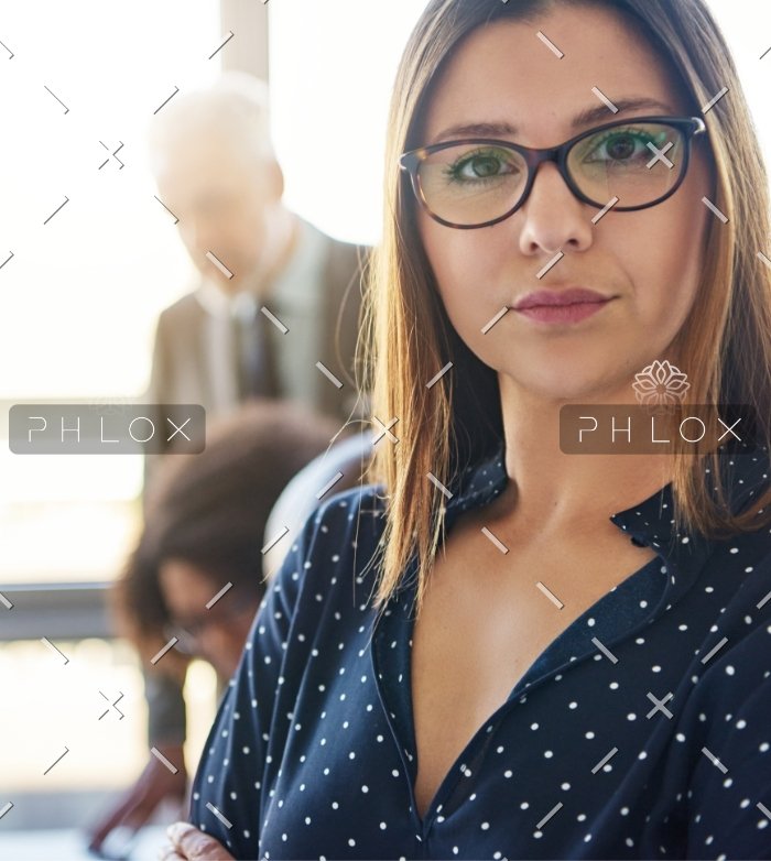 demo-attachment-40-serious-business-woman-in-front-of-team-S8KCP9H